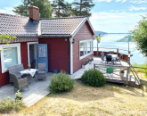 Fin och modern stuga m sjutsikt vid Dalbystrand